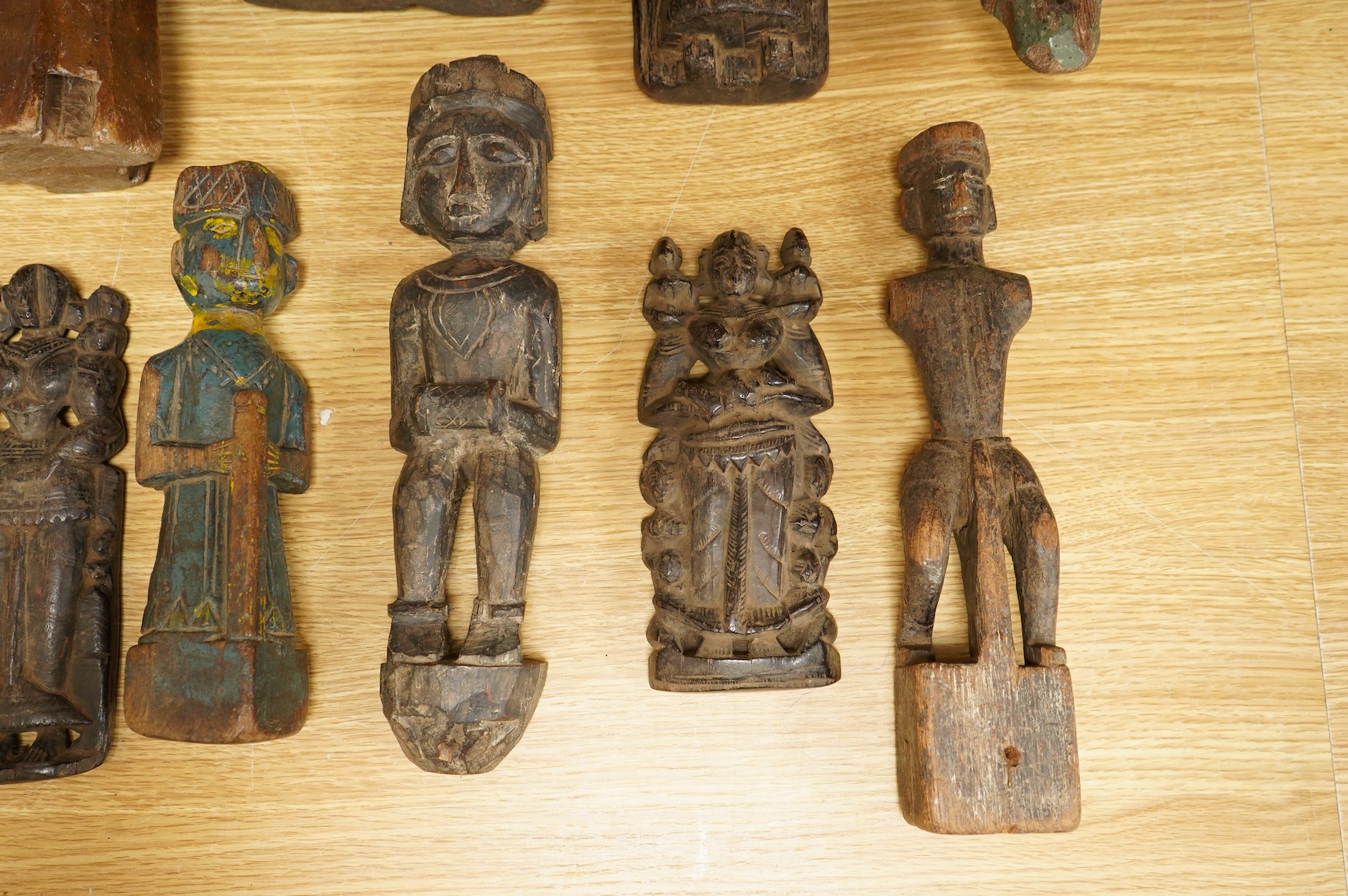 A group of Indian carved figures of deities, largest 42.5cm